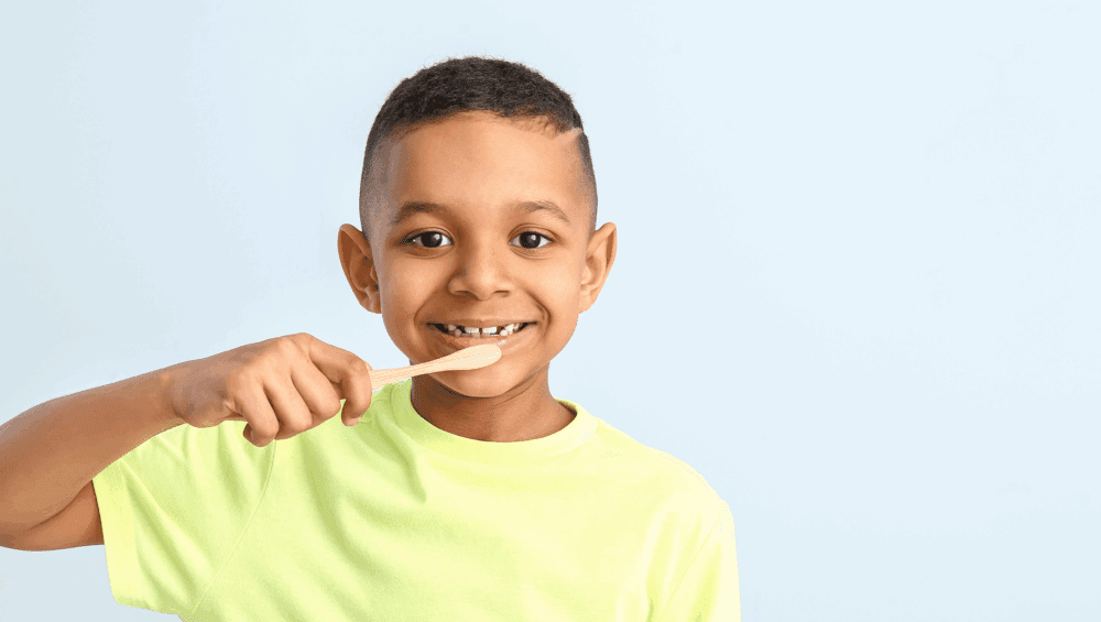 Small child brushing their teeth