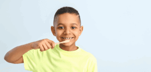 Small child brushing their teeth